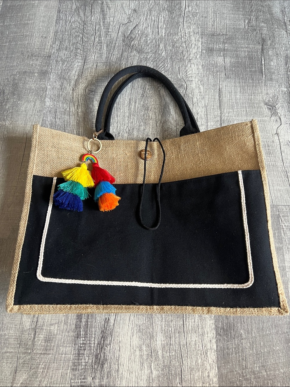Two-Tone Black and Natural Jute Tote with Rainbow Tassel Charm